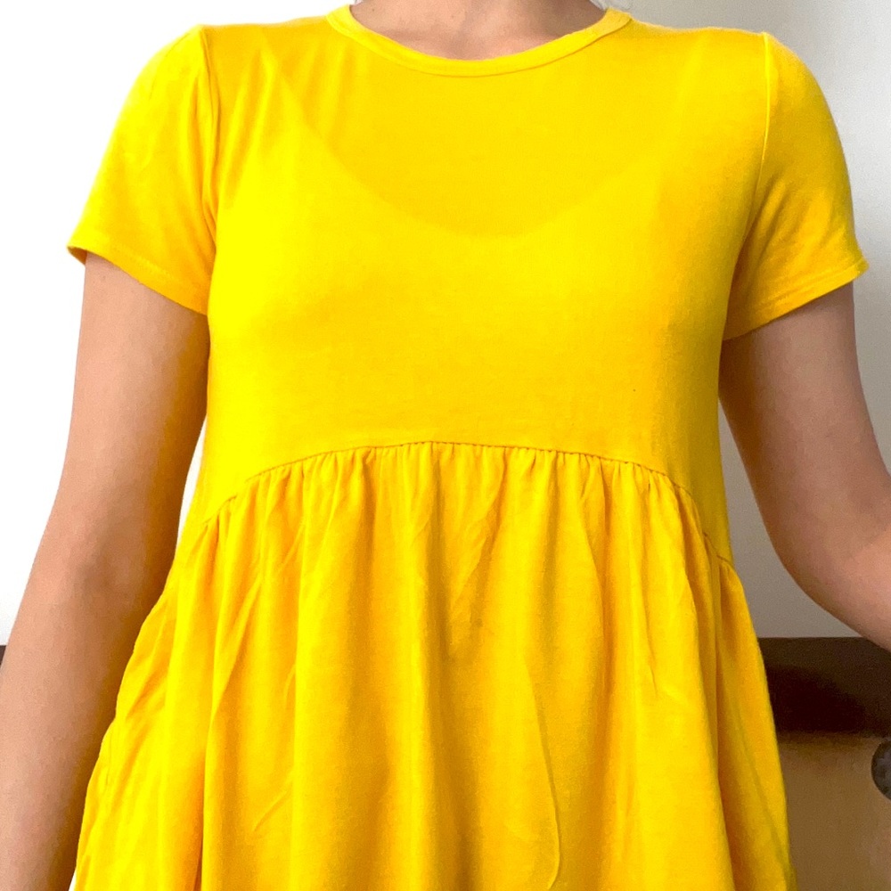 Gold stretchy shirt, 66% rayon, 4% spandex